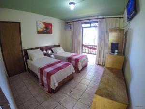 Postel nebo postele na pokoji v ubytování Paraíso das Águas Hotel Bahia
