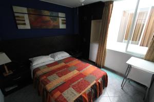 Postel nebo postele na pokoji v ubytování Hotel Chicama