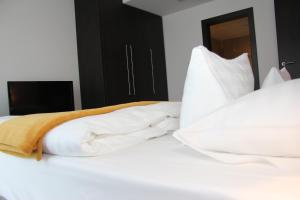 Voodi või voodid majutusasutuse Hotel Mousson toas