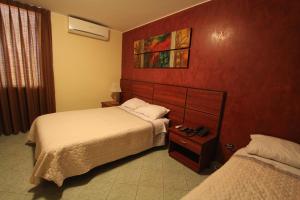 Postel nebo postele na pokoji v ubytování Hotel Chicama
