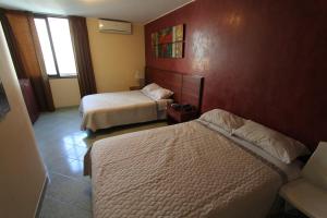 Postel nebo postele na pokoji v ubytování Hotel Chicama