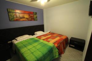 Postel nebo postele na pokoji v ubytování Hotel Chicama