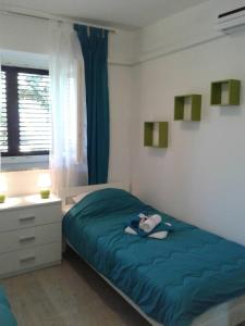En eller flere senger på et rom på Apartment Ilovik 154 - 3 bedroom