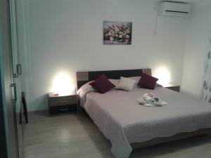 En eller flere senge i et værelse på Apartment Ilovik 154 - 3 bedroom