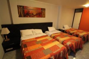 Postel nebo postele na pokoji v ubytování Hotel Chicama
