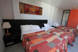 Postel nebo postele na pokoji v ubytování Hotel Chicama