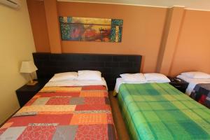 Postel nebo postele na pokoji v ubytování Hotel Chicama