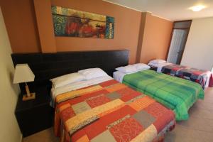 Postel nebo postele na pokoji v ubytování Hotel Chicama