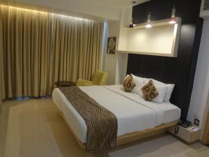 Cama o camas de una habitación en The Oriental Residency
