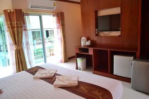 Ein Bett oder Betten in einem Zimmer der Unterkunft Aonang Village Resort