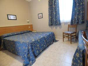 Llit o llits en una habitació de Hotel Turandot