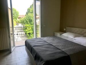 Postel nebo postele na pokoji v ubytování L’infinito residence