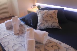 a bed with two towels on top of it at L' Antica Corte Lazzago in Como