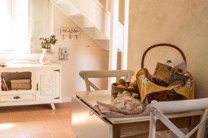 a kitchen with a table with a basket of food at Chão do Rio - Turismo de Aldeia - Serra da Estrela in Seia