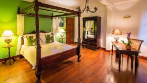 Letto o letti in una camera di Hotel l'Impératrice