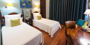 Letto o letti in una camera di Hotel l'Impératrice
