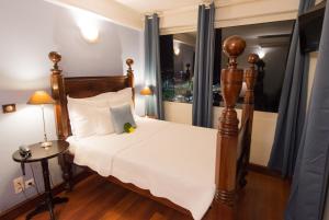 Letto o letti in una camera di Hotel l'Impératrice