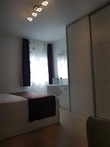 Posteľ alebo postele v izbe v ubytovaní Apartments Petričević