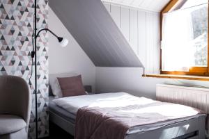 Cama o camas de una habitación en Gościniec Solisko Szczyrk