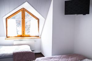 Posteľ alebo postele v izbe v ubytovaní Gościniec Solisko Szczyrk