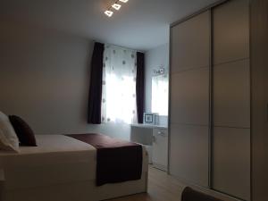 Posteľ alebo postele v izbe v ubytovaní Apartments Petričević