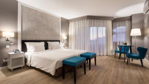 Кровать или кровати в номере AP Oriental Beach - Adults Friendly