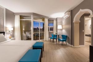 Кровать или кровати в номере AP Oriental Beach - Adults Friendly