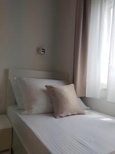 Posteľ alebo postele v izbe v ubytovaní Apartments Petričević