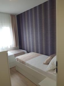 Cama o camas de una habitación en Apartments Petričević