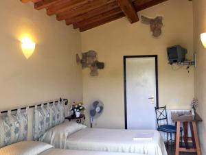 Ένα ή περισσότερα κρεβάτια σε δωμάτιο στο Affittacamere Anselmi Sauro
