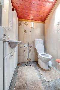a bathroom with a toilet and a sink at D&L Apartment in center in Pula