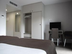 Posteľ alebo postele v izbe v ubytovaní Hotel Ton