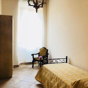 Ένα ή περισσότερα κρεβάτια σε δωμάτιο στο Casa Vacanze La Torretta