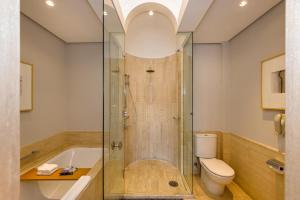 a bathroom with a shower and a toilet at Grand Hyatt São Paulo in São Paulo