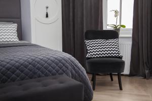 Posteľ alebo postele v izbe v ubytovaní Apartament 51 z miejscem parkingowym