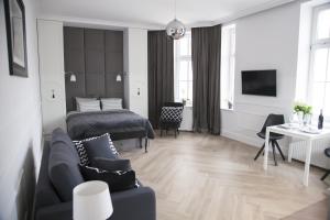 Televízia a/alebo spoločenská miestnosť v ubytovaní Apartament 51 z miejscem parkingowym