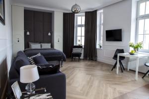 Televízia a/alebo spoločenská miestnosť v ubytovaní Apartament 51 z miejscem parkingowym