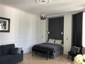 Posteľ alebo postele v izbe v ubytovaní Apartament 51 z miejscem parkingowym