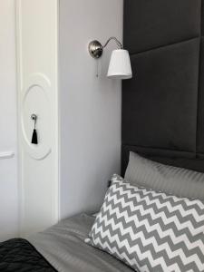 Posteľ alebo postele v izbe v ubytovaní Apartament 51 z miejscem parkingowym