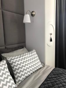 Posteľ alebo postele v izbe v ubytovaní Apartament 51 z miejscem parkingowym
