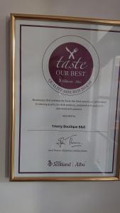 a picture of a certificate in a picture frame at Trinity Boutique B&B in Peterhead