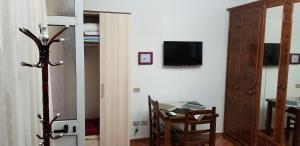 Televiisor ja/või meelelahutuskeskus majutusasutuses Berti Apartment