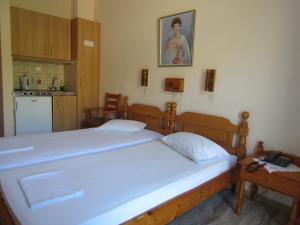 Ein Bett oder Betten in einem Zimmer der Unterkunft Sandalis Hotel