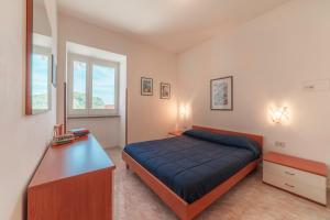 Tempat tidur dalam kamar di Villa San Lorenzo