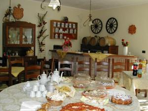a table with food and dishes on top of it at Agriturismo Trivilini in Lanciano