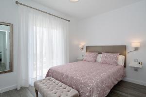 Un pat sau paturi într-o cameră la Rociega A