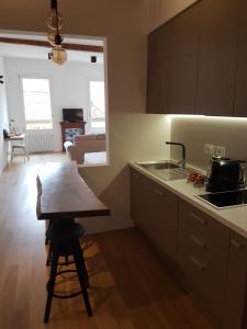 a kitchen with a table and a counter top at Casa Tea in Bologna +12 photos