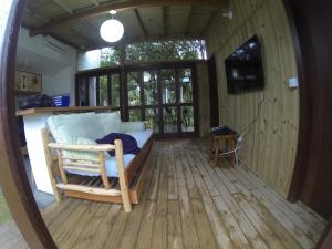 TV a/nebo společenská místnost v ubytování Pousada Guarda Beach House