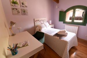 Postel nebo postele na pokoji v ubytování Arbesa Huesca
