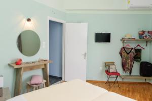 A television and/or entertainment centre at Kalamata Art Rooms